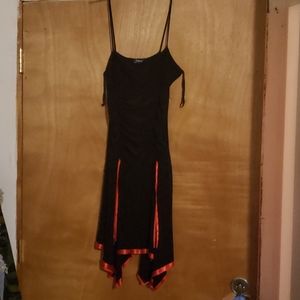 Taboo little black dress sassy and sexy, with red trim size LG